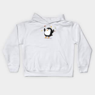 Penguin having fun with autumn leaves Kids Hoodie